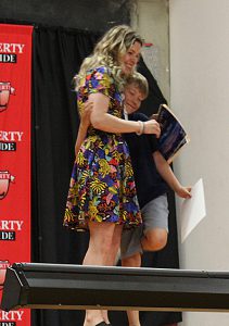 A student hugs a teacher
