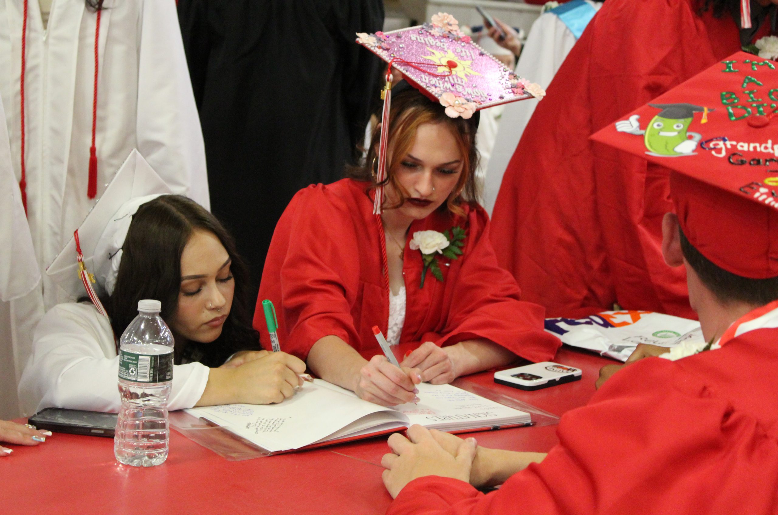 IMG_7478 Two students sign a yearbook