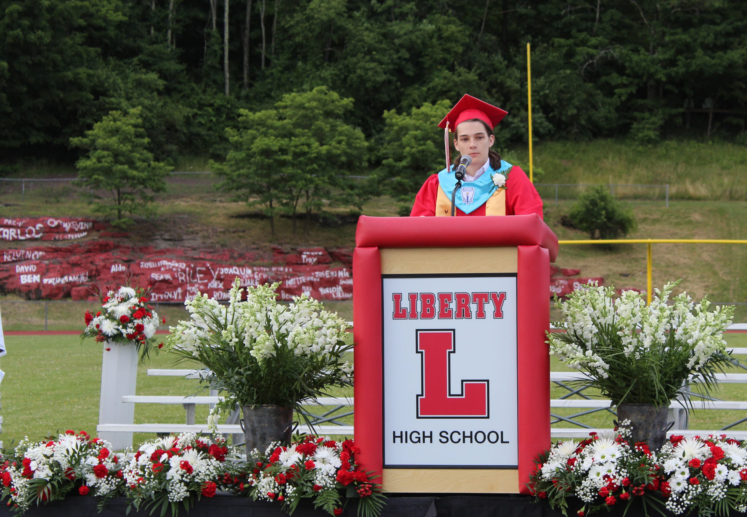 IMG_7540 A graduate speaks at a podium