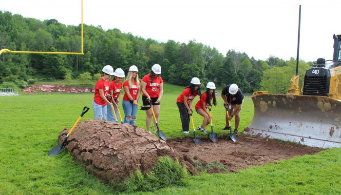 groundbreaking9 Students and a teacher dig at the groundbreaking area.