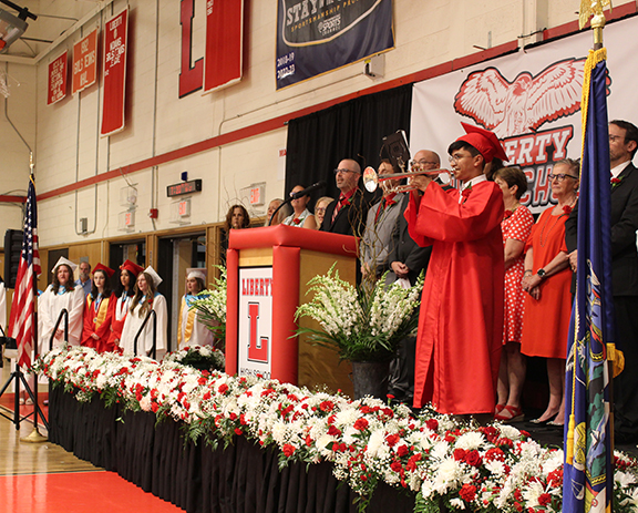 graduation19 A student plays trumpet on stage