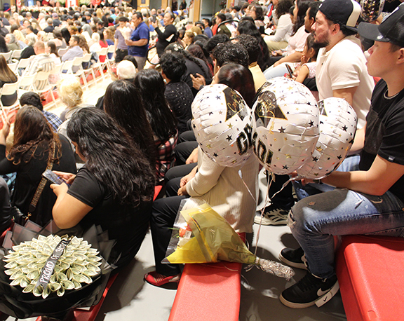 graduation16 Members of the audience hold graduation gifts