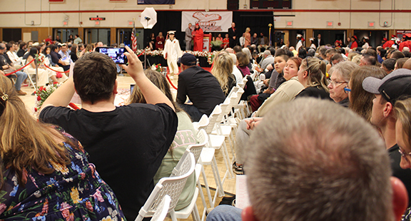 graduation10 Audience members take photos at a graduation