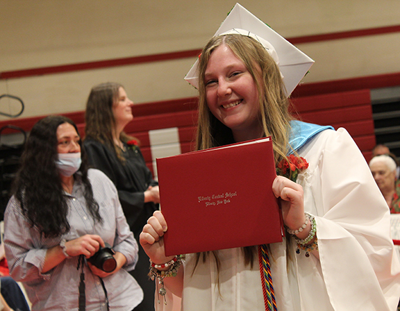 graduation5 A student holds a diploma