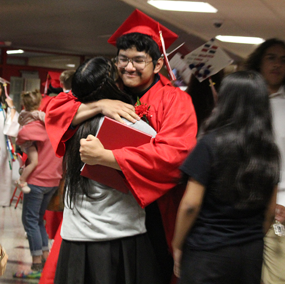 graduation3 A graduate hugs and adult