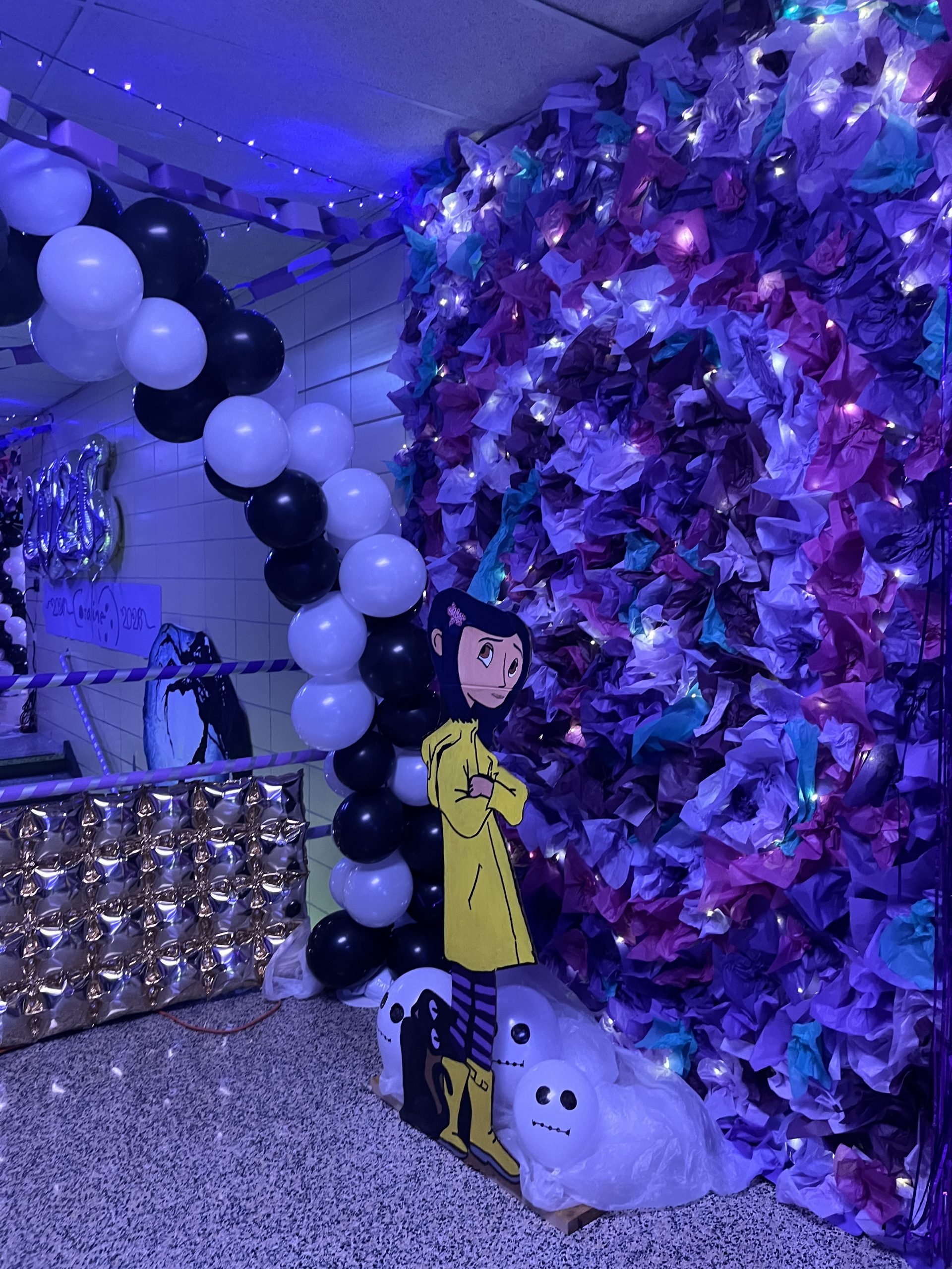 A niche is decorated in a Coraline theme.