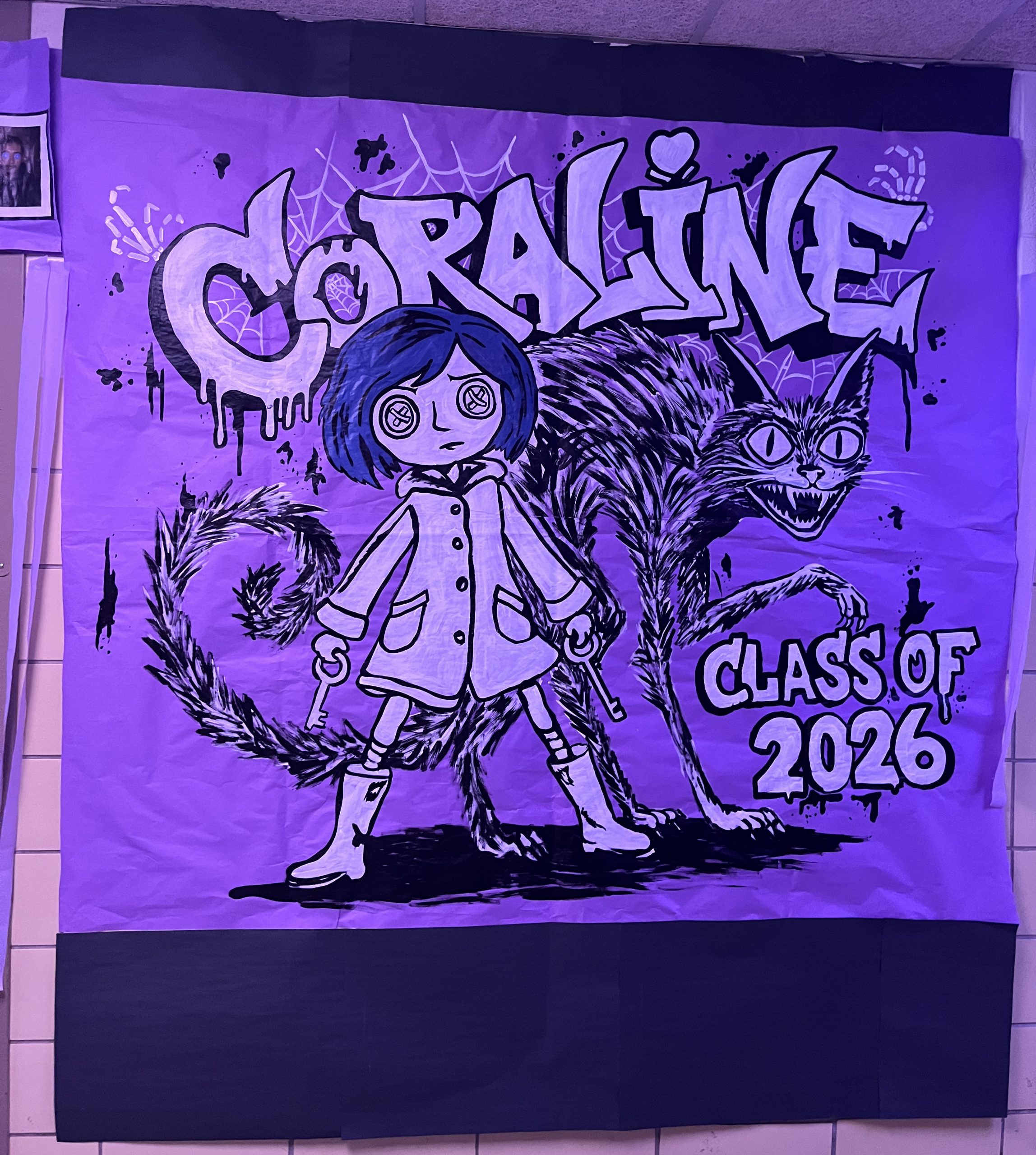 A sign featuring Coraline and the Class of 2026