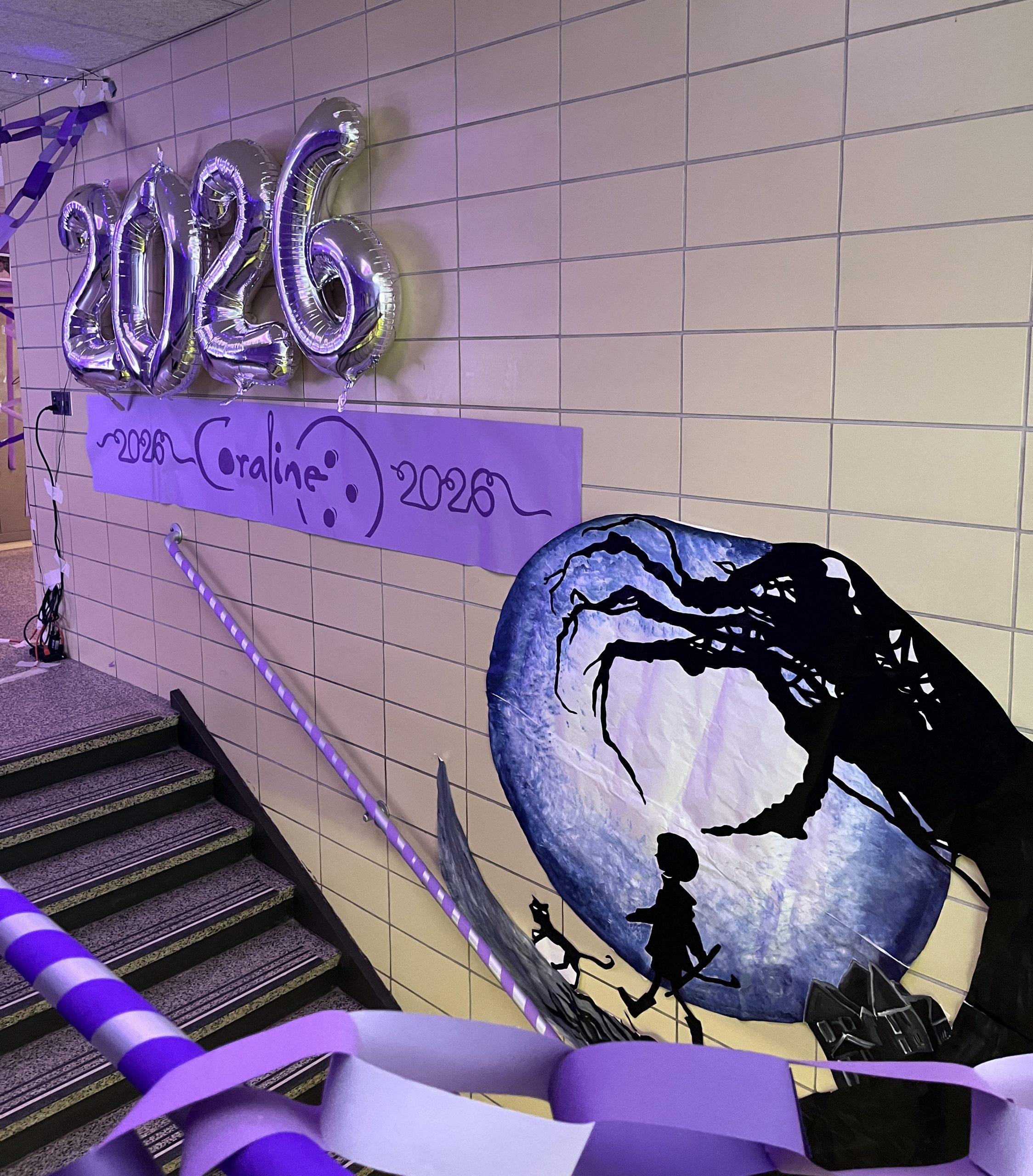 A stairway is decorated in A Coraline theme