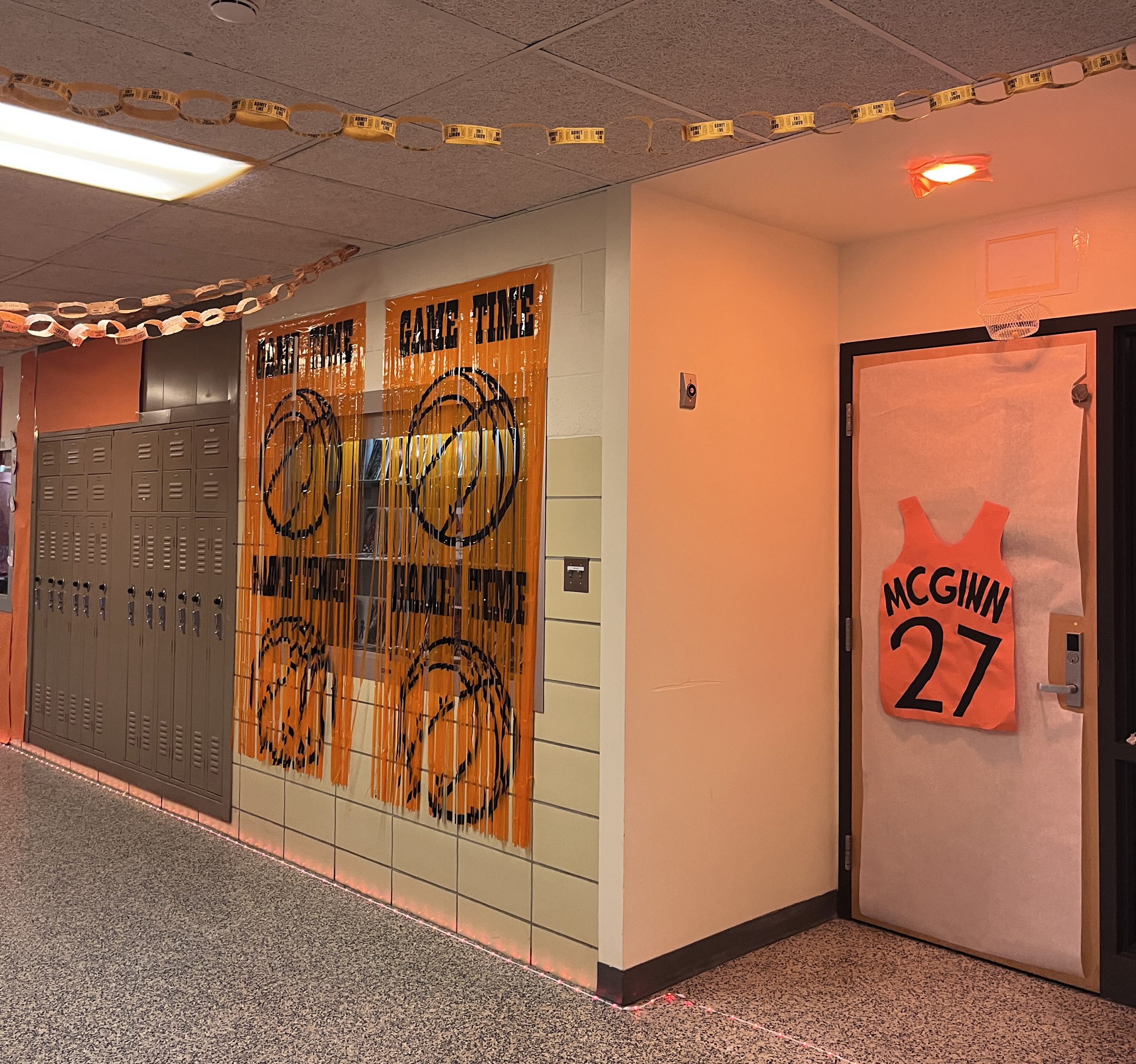 A door and hallways are decorated in Space Jam basketball items