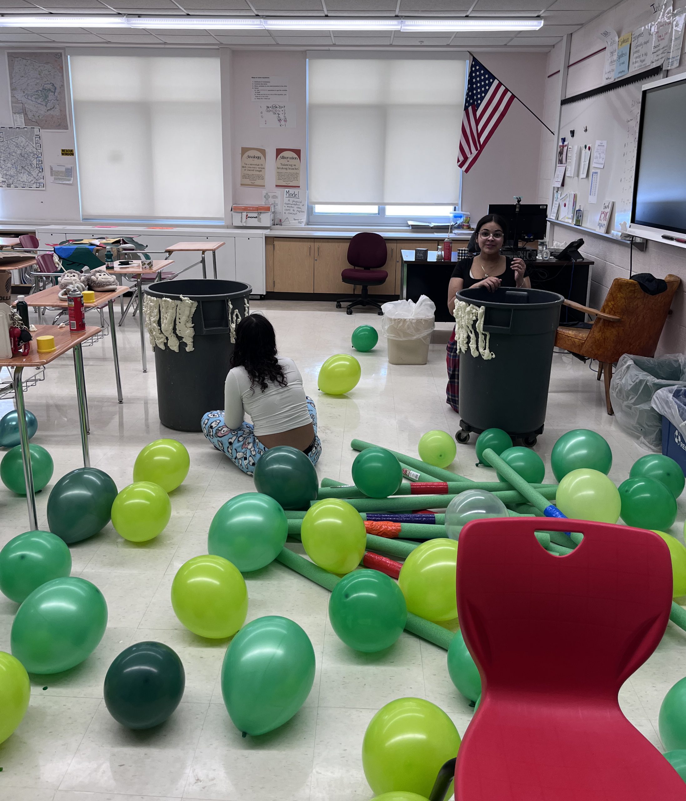 Two students prepare decorations for their Ninja Turtle hallway