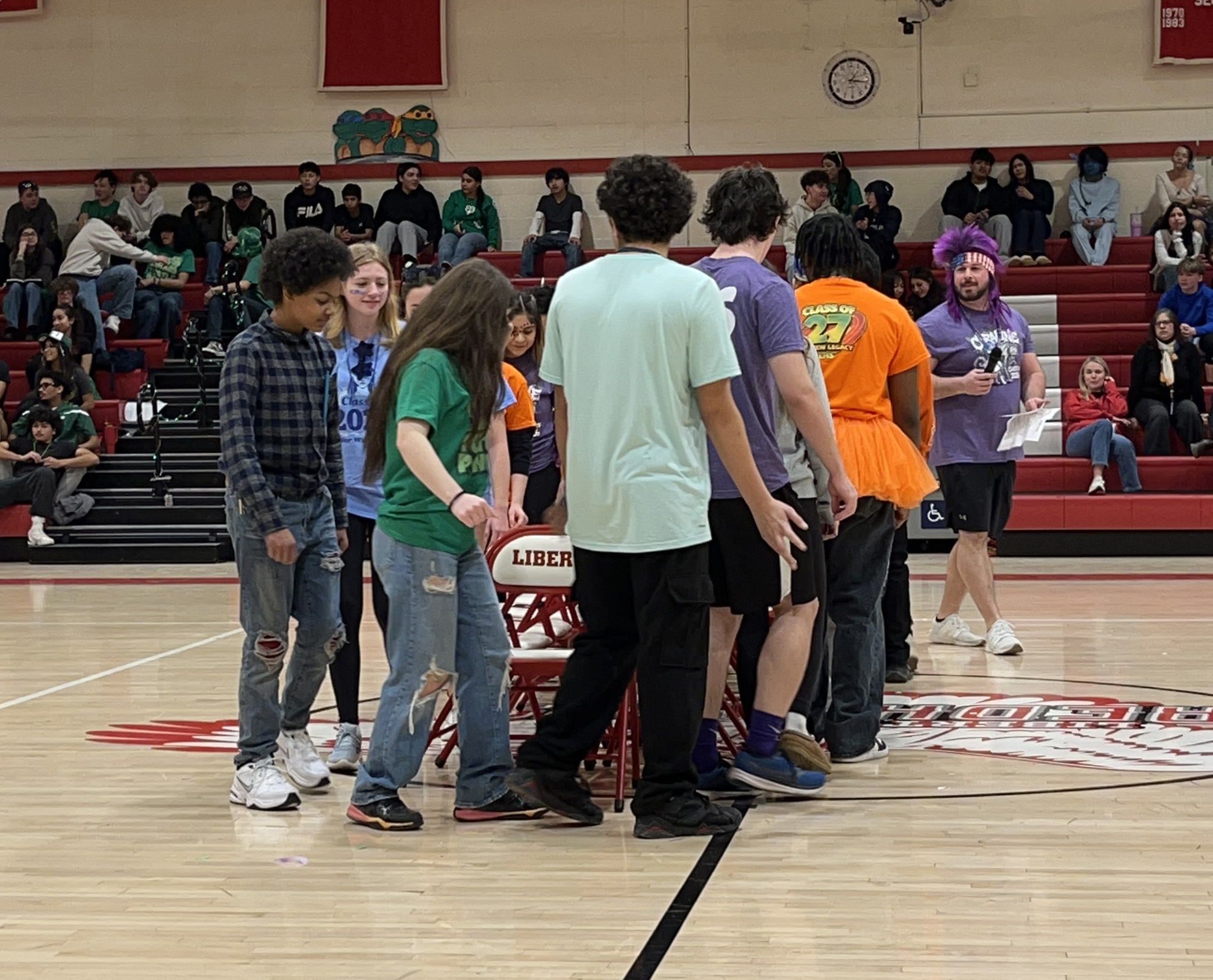Students play musical chairs in the gymnasium