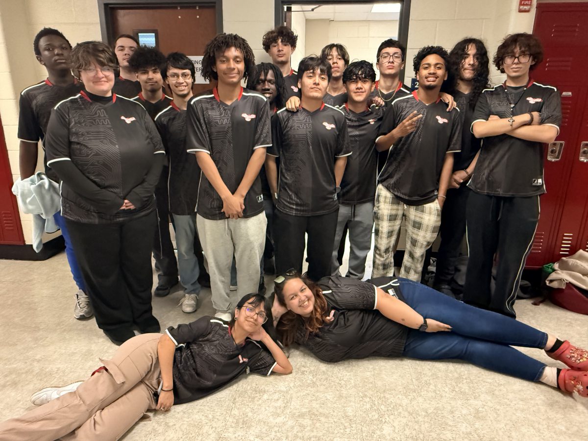 Esports team members pose for a photo.