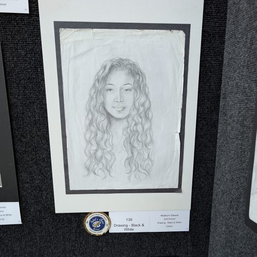 A black and white drawing of a girl